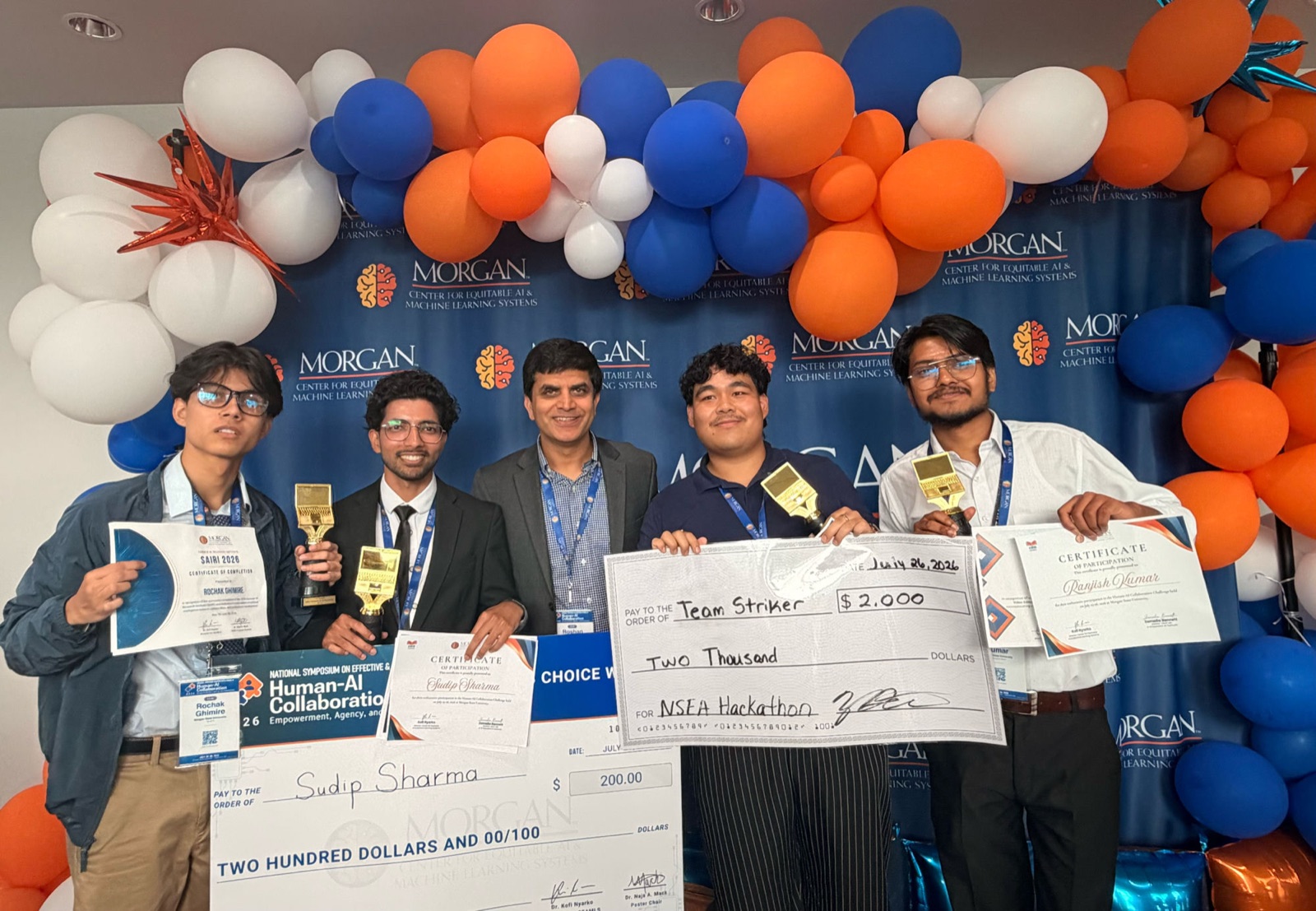Rochak Ghimire and teammates holding certificates and prize checks at the CEAMLS Human-AI Collaboration Challenge awards ceremony at Morgan State University.